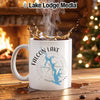 White mug with Falcon Lake Texas map, compass, and steam.