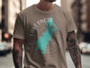 Brown t-shirt featuring a turquoise outline of Lake Onota, Massachusetts, with surrounding compass rose graphic.
