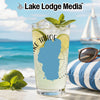 Glass with Lake Tahoe map silhouette and mint on a beach with sailboat.