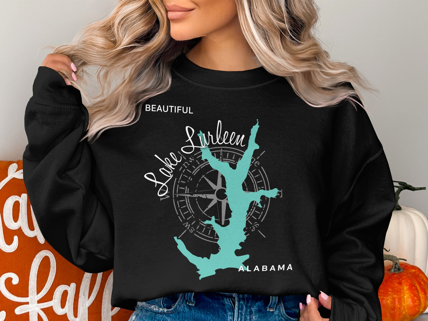 Black sweatshirt with a teal lake outline and compass rose graphic, "Lake Lurleen Alabama" text.