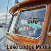 Sticker with "Atsion Life" text and turquoise water outline on boat window.