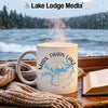 White mug with "Mark Twain Lake Missouri" design sits by a window.