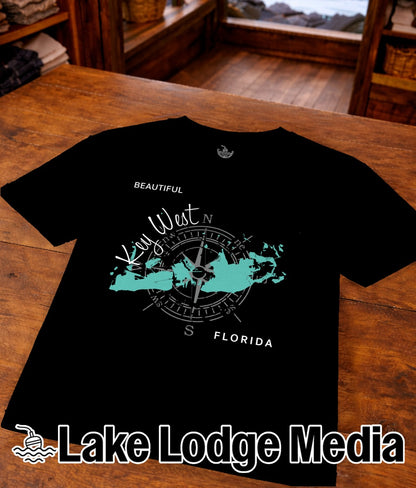 Black t-shirt with a teal map of Key West and a compass rose.