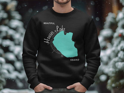 Black sweatshirt with teal Hauser Lake Idaho map and compass graphic.