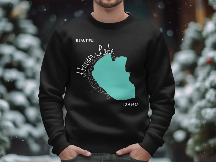 Black sweatshirt with teal Hauser Lake Idaho map and compass graphic.