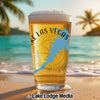Glass of beer with "Lake Las Vegas" and Nevada map, beach background