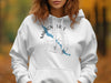White hoodie with Maligne Lake Canada map and compass graphic.
