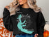 Black sweatshirt with teal Mississippi map and compass graphic.