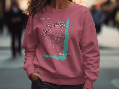 Pink sweatshirt featuring a compass rose and map outline of Lake Vermilion, Minnesota.