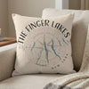 Decorative pillow with "The Finger Lakes New York" text and compass design.