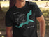 Black t-shirt with a teal map of Lake Jackson, Georgia, and compass graphic.