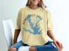 Light yellow t-shirt with Lewisville Lake Texas map and compass graphic.