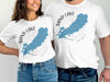 White t-shirts with blue Sand Lake, Ontario map and compass design.