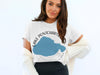 White t-shirt with blue Lake Pontchartrain graphic and compass design.