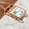 Christmas ornament on a wooden sled reading "Merry Christmas From Clear Lake".