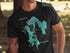 Black t-shirt with teal Massabesic Lake map and compass design.