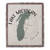 Woven throw blanket with Michigan map graphic and compass rose design.