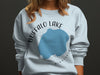 Light blue sweatshirt with "Buffalo Lake Minnesota" text and lake graphic.