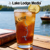 Glass of iced tea with Lake Oahe map and compass design, garnished with lemon.