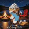 Glass of coffee topped with whipped cream and a blue map shape.