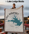 Man holding a blanket with Lake Rampart, Colorado map and compass design.