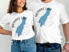 White t-shirts with "Moraine Lake Alberta" design and blue lake silhouette.