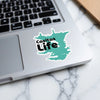 Casitas Life sticker on a laptop keyboard with marble background.